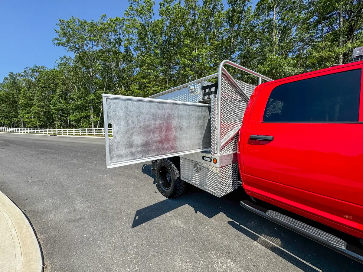 Lower right-side compartment open with fold-down door and interior cavity.
